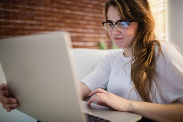 Pretty woman using her laptop — Stock Photo, Image