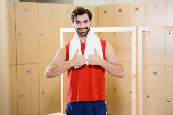 Smiling man showing thumbs up — Stock Photo, Image