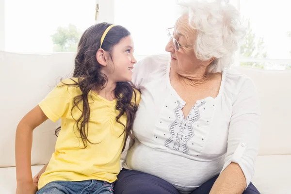 Grandmother and granddaughter looking at each other — Stock Photo, Image