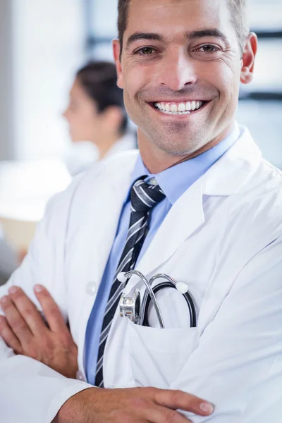 Doctor smiling at the camera — Stock Photo, Image