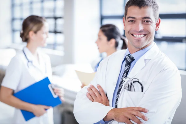 Doctor smiling at the camera — Stock Photo, Image