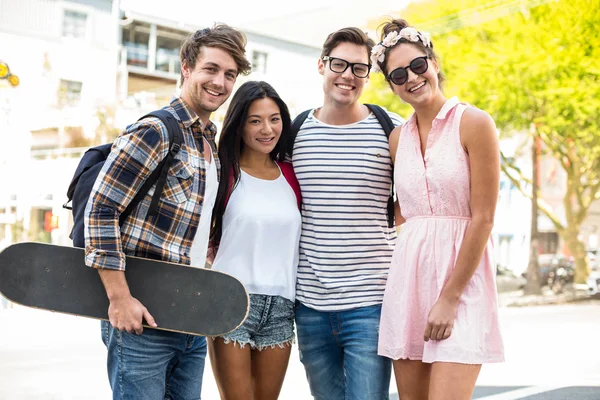 Hip friends smiling at the camera — Stock Photo, Image