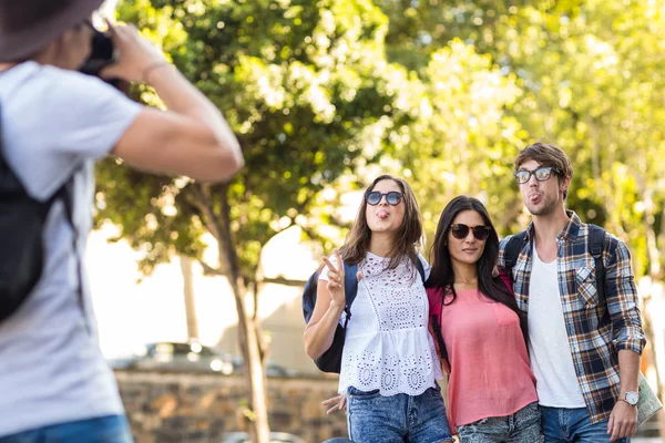 Hip man taking picture of his friends — Stock Photo, Image