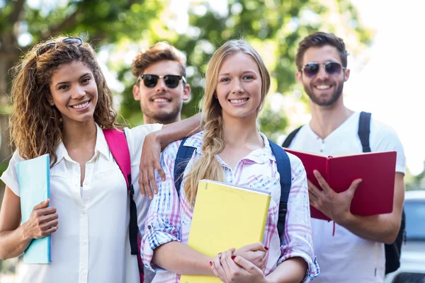 Hip friends holding notebooks — Stock Photo, Image