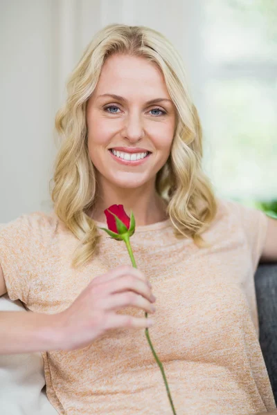 Pretty woman smelling a rose — Stock Photo, Image