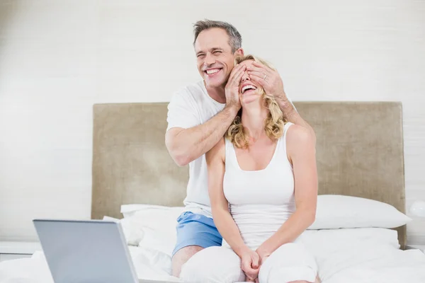 Husband making a surprise to wife — Stock Photo, Image