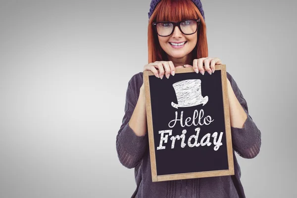 Smiling hipster woman holding blackboard — Stock Photo, Image