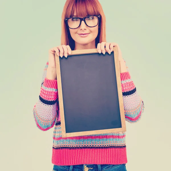Hipster woman holding blackboard — Stock Photo, Image