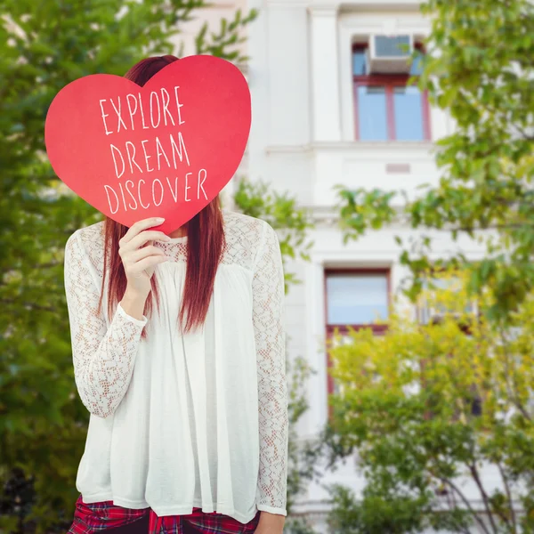 Hipster woman behind a red heart — Stock Photo, Image