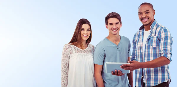 Young creative team looking at tablet — Stock Photo, Image