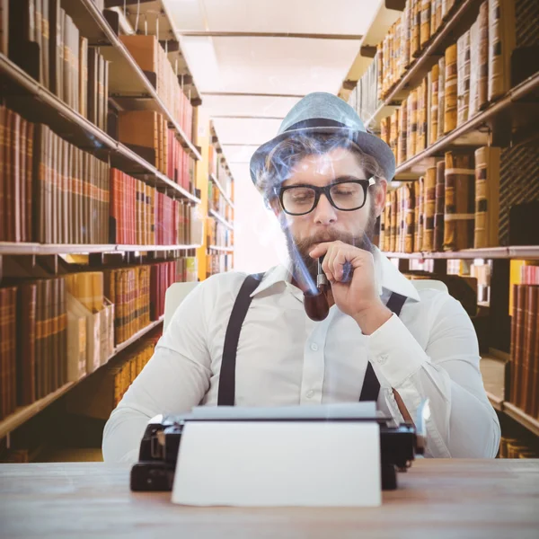 Hipster smoking pipe while sitting — Stock Photo, Image