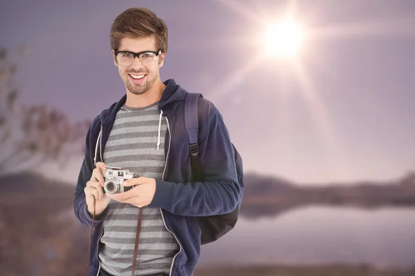 Happy man holding  camera — Stock Photo, Image