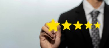 High quality. business man customer hand pointing on five star button on visual screen to review good rating, digital marketing, good experience, positive thinking and customer feedback concept clipart