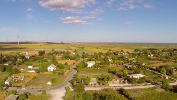 Flying over a small village in Romania — Stock Video