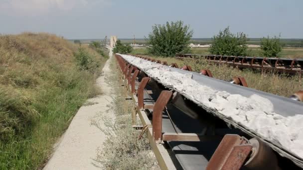 Conveyor belt transporting stones — Stock Video