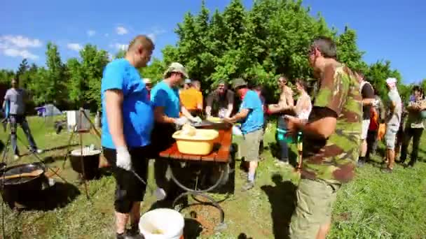 Ecological tourism festival,people serving traditional food (timelapse) — Stock Video