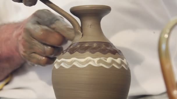 Craftsman shapes pottery on an classic potter's kick wheel — Stock Video