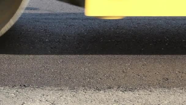 Road rollers leveling fresh asphalt pavement — Stock Video