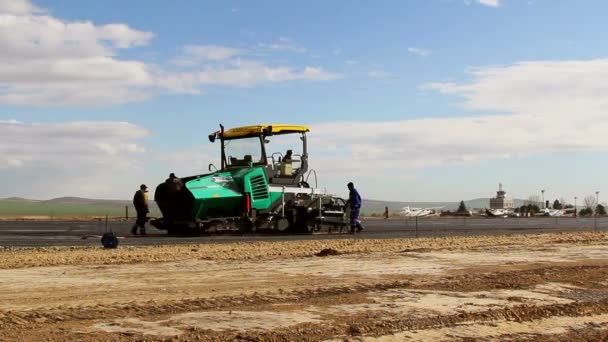 Tracked paver laying fresh asphalt pavement,time lapse — Stock Video