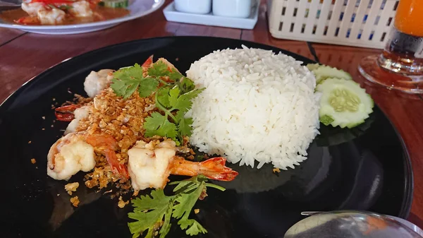 Thai street food. Rice with seafood.