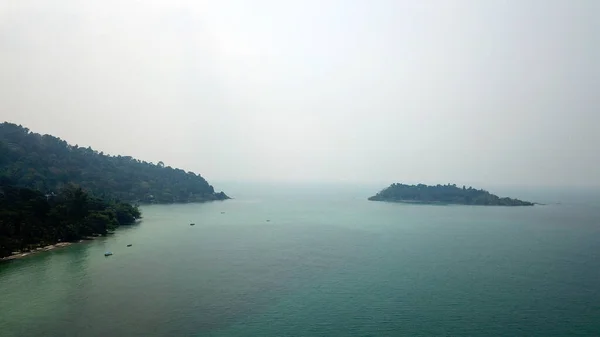 Smog over the island of Koh Chang. Green hills.