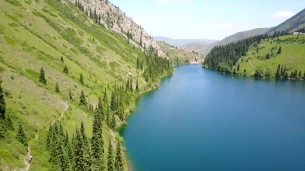 Kolsay lake among green hills and mountains. — Stock Video