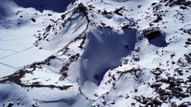 A group of people passes through the glacier.