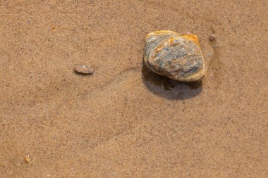 Deniz taşları arka planı. Dalgalı kumsal. Yunanistan, Avrupa.