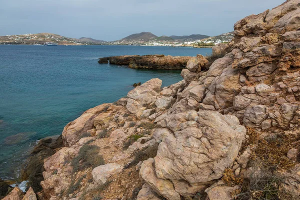 Rocky, Aegean coast on the west side of the Paros Island. Hills around. Greece.