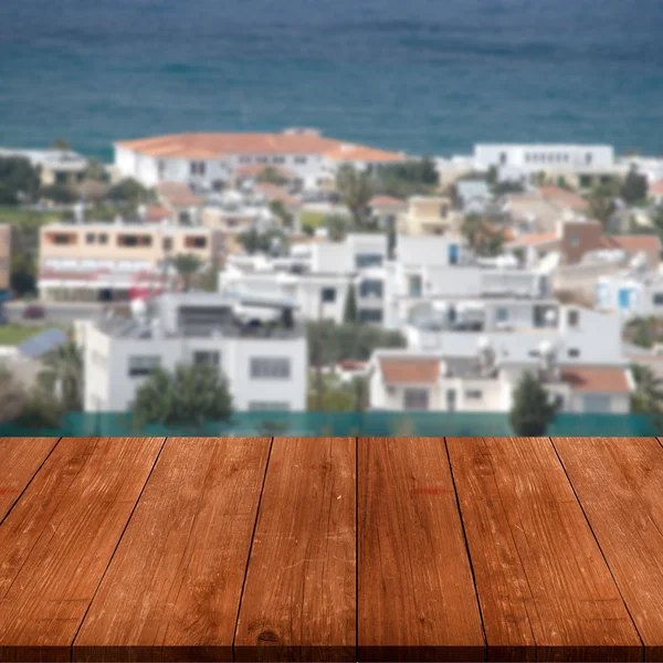 Vista da cidade de Paphos sobre a velha mesa ou tábua de madeira escura. Colagem — Fotografia de Stock