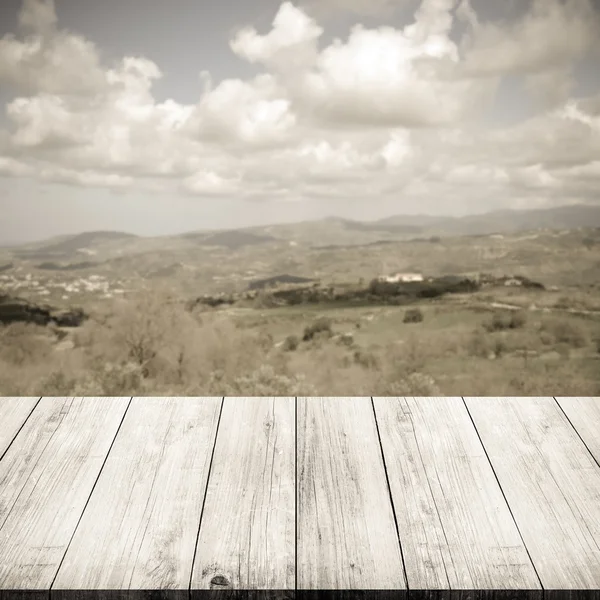 Green valley of Cyprus over old light wooden table or board. Col — Stock Photo, Image