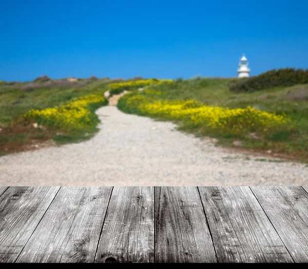 Beautiful view of the green meadow over old light wooden table o — Stock Photo, Image