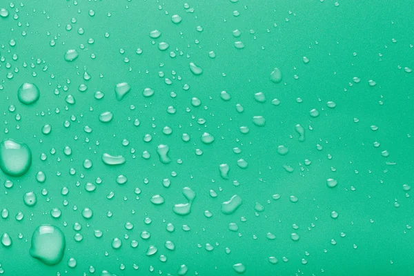 Dops of water on a color background. Green. Toned — Stock Photo, Image