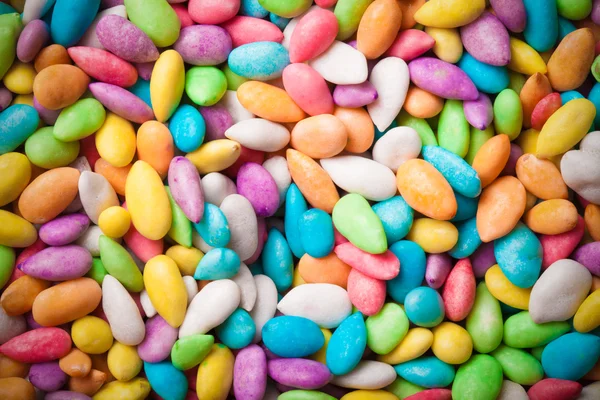 Colored sunflower seeds as texture for background. Toned — Stock Photo, Image