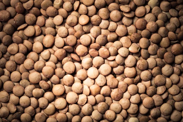 Semillas de lentejas naranjas como textura para el fondo. Tonificado — Foto de Stock