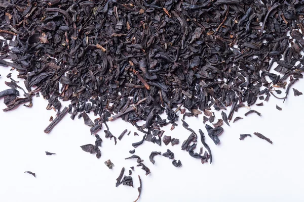 Hojas de té negro seco como textura para el fondo — Foto de Stock