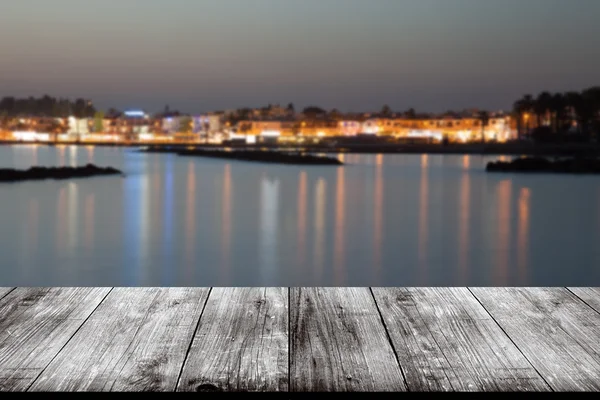 View of Cyprus town over old light wooden table or board. Collag — Stock Photo, Image