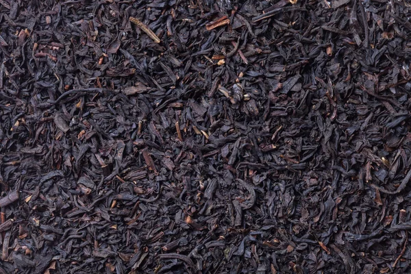 Feuilles de thé noir sèches comme texture de fond — Photo