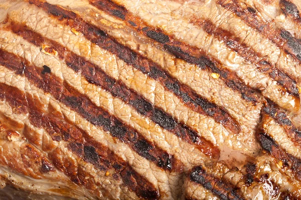 Large piece of fresh beef meat prepared on a grill pan — Stock Photo, Image