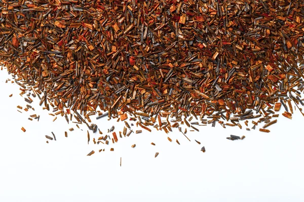 Folhas de chá de rooibos secas como textura para fundo. Tonificado — Fotografia de Stock