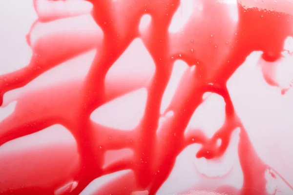 Manchas de esmalte espejo rojo en la superficie abstracta —  Fotos de Stock