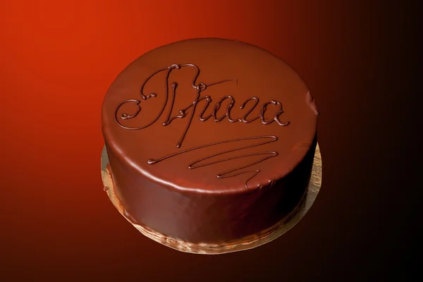 Renkli arka plan üzerinde yazıt "Praga" ile çikolatalı kek — Stok fotoğraf