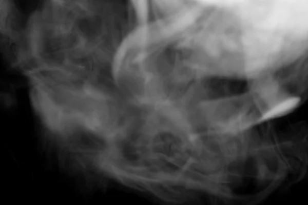 Nuvola di fumo su sfondo nero. Sfocato — Foto Stock