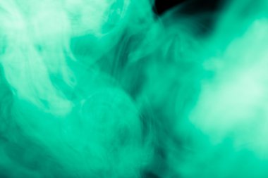 Bir siyah arka plan üzerinde duman bulutu. Defocused. Tonda