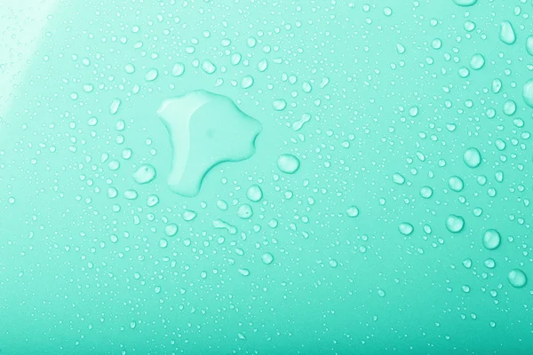 Drops of water on a color background. Green. Shallow depth of fi — Stock Photo, Image