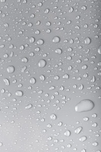 Gotas de agua sobre un fondo de color. Gris —  Fotos de Stock