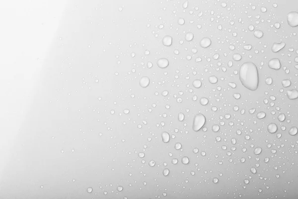 Gotas de agua sobre un fondo de color. Gris. Profundidad superficial de fie — Foto de Stock