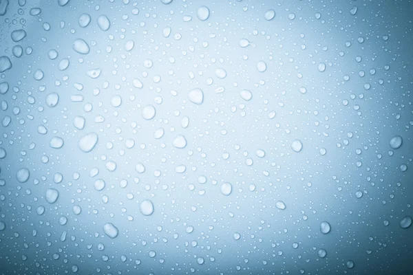Drops of water on a color background. Blue. Selective focus. Ton — Stock Photo, Image
