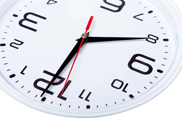 White wall clock with black arrows. Selective focus. Shallow dep — Stock Photo, Image