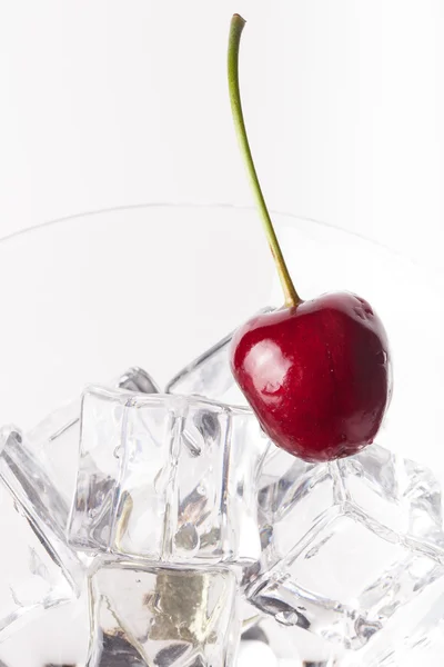 Cherry berries in a martini glass on white background — Stock Photo, Image